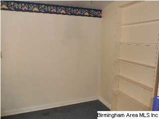 Separate wash room with shelving for storage locat