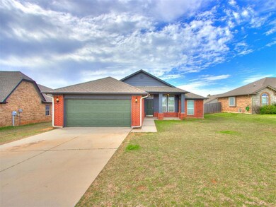 Single story home with a front lawn and a garage