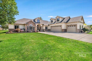 View of front facade with stone siding, a garage, a front lawn, concrete driveway, and stucco siding