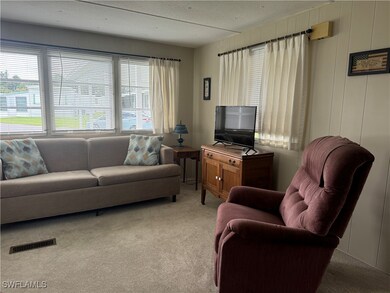 Living room featuring carpet floors
