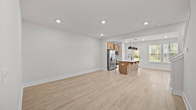 Spacious family room in two story townhome at Clayton Crossing by DRB Homes in Arden, NC