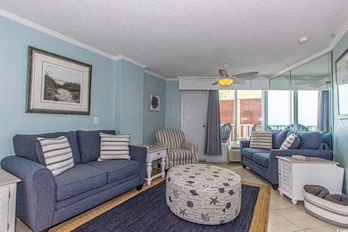 Living room with light tile patterned flooring, cr