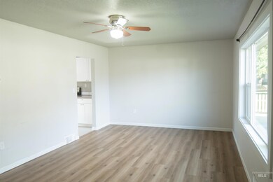 Unfurnished room with light wood-type flooring and ceiling fan