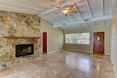 Living room with wood burning fireplace