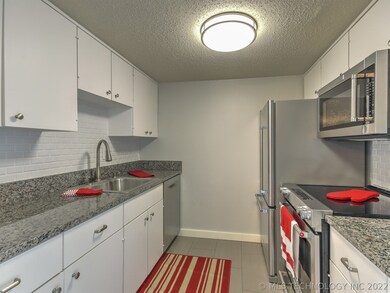 Granite kitchen, subway tile backsplash and stainl