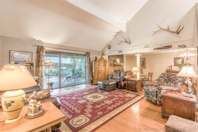 Living room with view of back patio and pool area