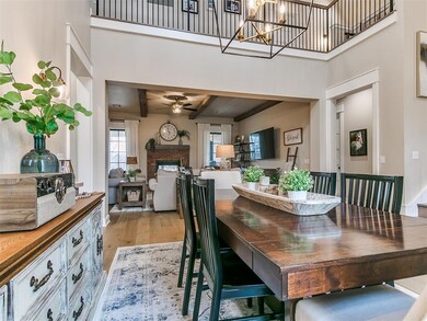 Dining space featuring beamed ceiling, a fireplace