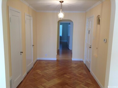 A view of the entry foyer with hardwood floors and