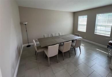 Formal dining room with 8-seat table included in rental or formal living room.