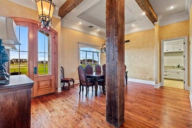 Front door of home to left looking into dining roo