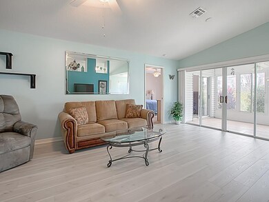 LOOK AT ALL THE LIGHT COMING IN FROM YOUR ENCLOSED LANAI WITH SLIDING DOORS!