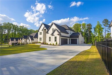 View of front of house featuring concrete driveway and a garage