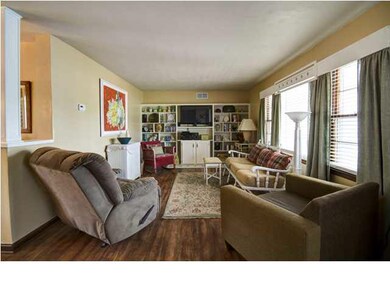 Living Room with Built-Ins and Hardwood Floors