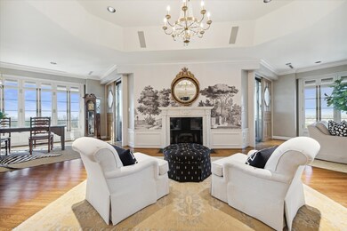 The expansive living spaces include a seating area