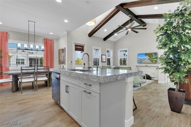 Kitchen featuring an island with sink, a healthy a