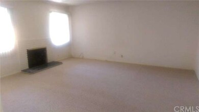 Brand new carpet throughout living room, hallway and bedrooms. This is the living room with built in fireplace.
