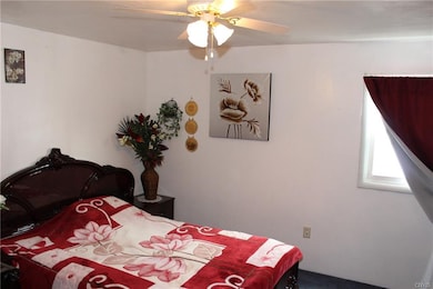 1st floor bedroom with new window and wall to wall