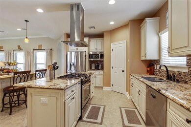 Cook station island. Stainless steel vent hood & a