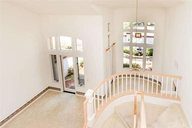 Looking down into the living and dining room from 