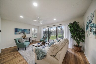 The living room opens to the patio and offers sere