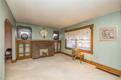 Living room with decorative fireplace with capped gas line