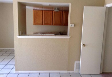 Living room looking to kitchen/dining