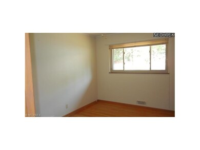 Bedroom 2 with hardwood flooring