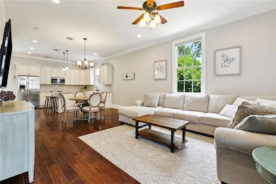 Living Room looking into Dining Room and Oen Kitch