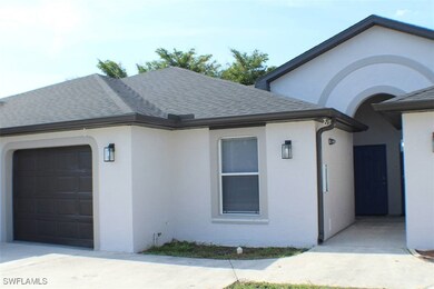 View of side of home with a shingled roof, stucco