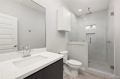 Full bath featuring visible vents, toilet, a shower stall, recessed lighting, and vanity