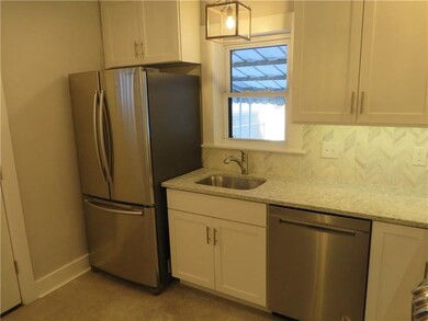More kitchen with stainless refrigerator and dishw