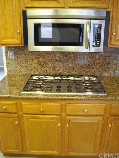 Kitchen range top and built in microwave