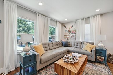 Living area with recessed lighting and wood finis