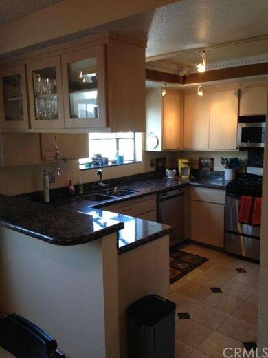 Kitchen with granite counter tops, marble tile, Ki