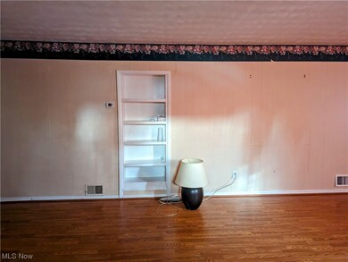 Spare room with wood-type flooring