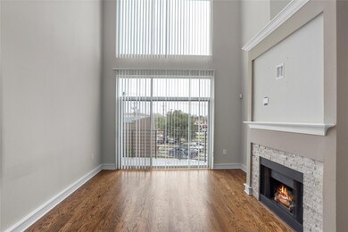 Living area features floor to ceiling windows