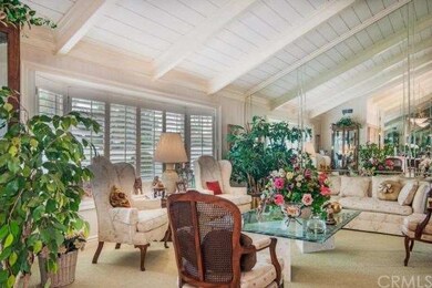 The formal living room area with vaulted ceilings