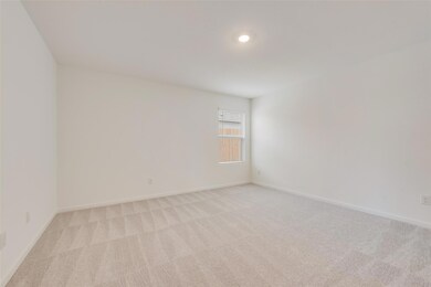 Empty room with light colored carpet