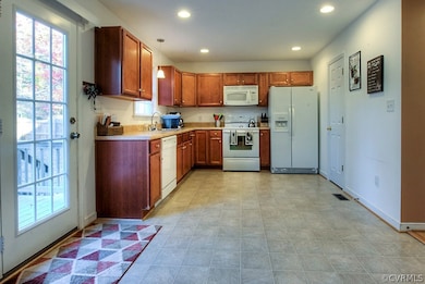 Spacious eat in kitchen with pantry, deck access,
