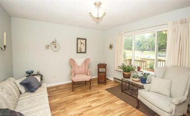 Living room with large picture window with view of