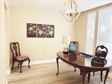 The formal dining room can easily serve as home office/study.