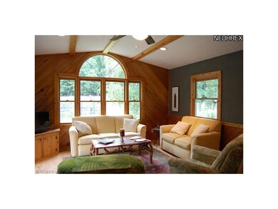 Family Room with vaulted ceiling, hardwood floors 