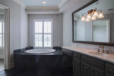 Bathroom with crown molding, visible vents, and pl