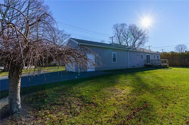back yard, driveway, garage, and deck