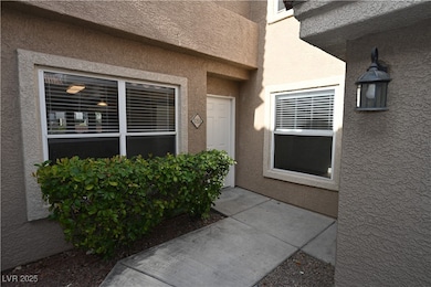 Entrance to property featuring stucco siding