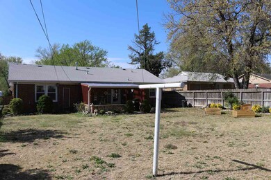 view of the back of the house with clothesline