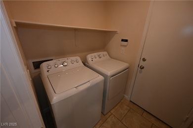 Clothes washing area featuring separate washer and
