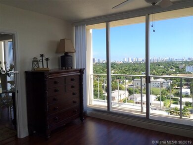 Floor to ceiling windows provide views of downtown