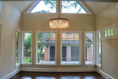 Inviting sun lite dining room with brilliant cryst