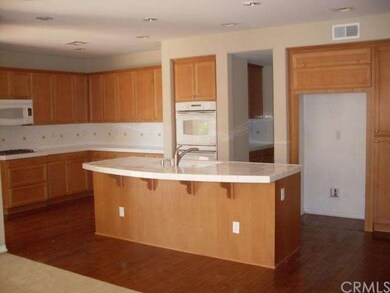 Huge kitchen with double ovens and an island perfe